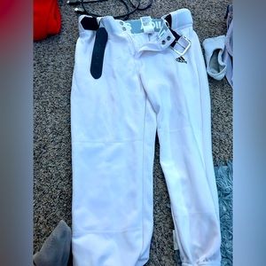white adidas softball pants and a black adidas belt that comes with it